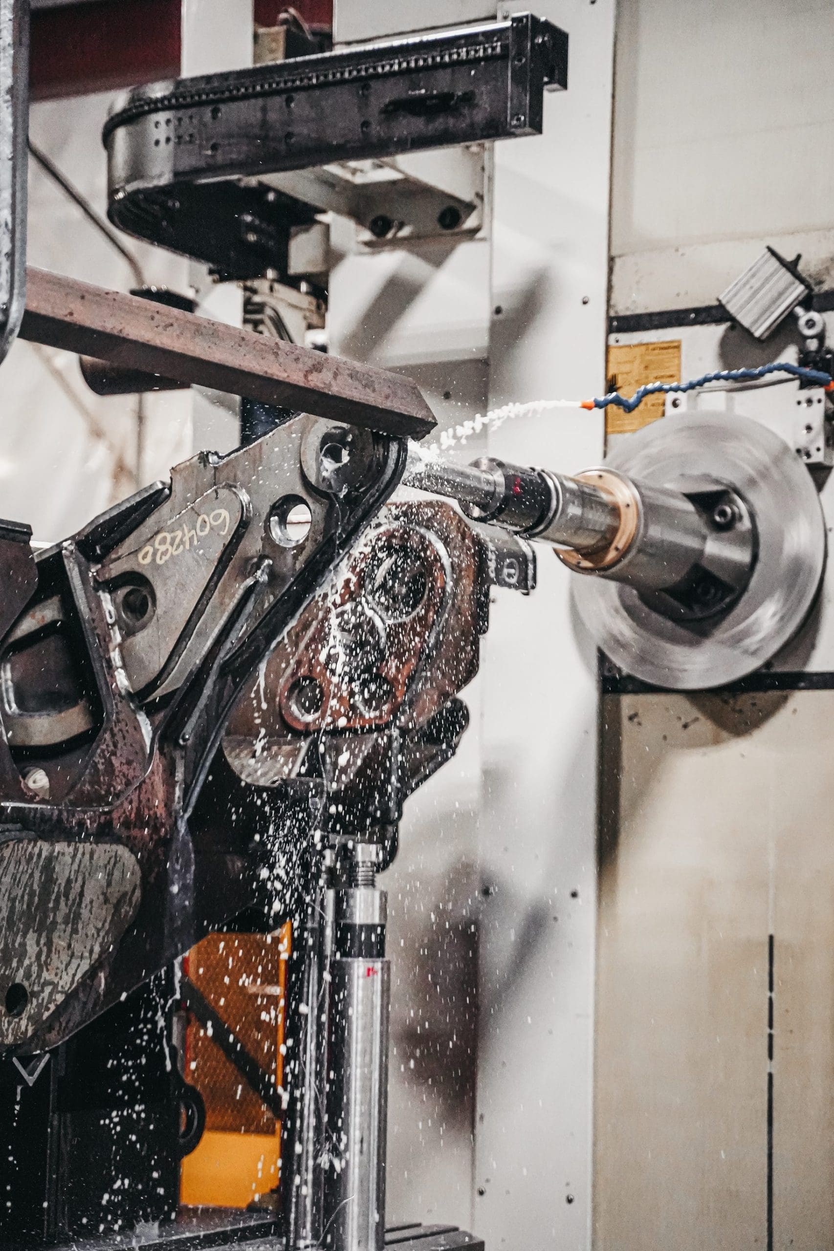 Machine sprays water for cooling during the CNC Machining Process