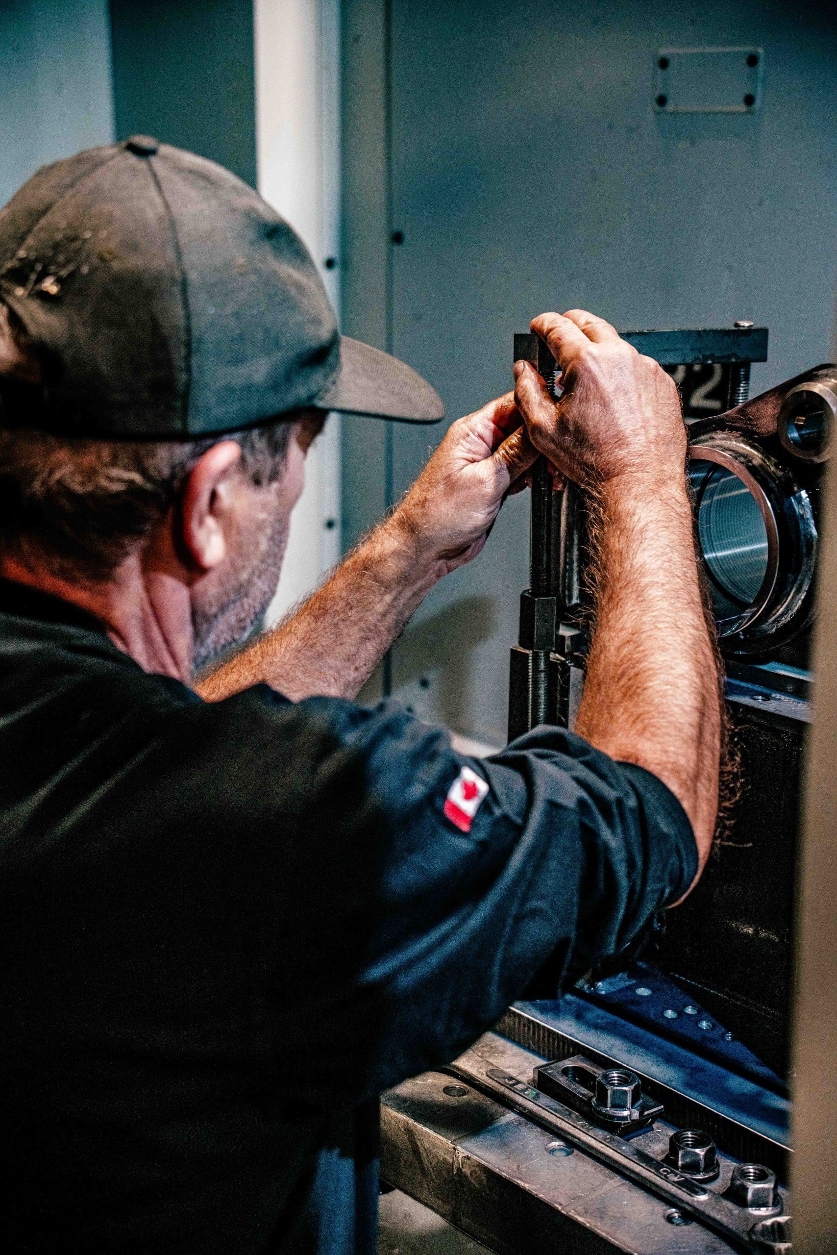CNC Machining Manufacturer employee works on machine